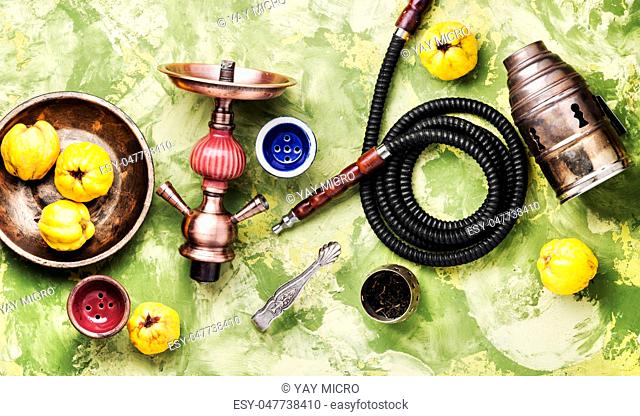 Oriental smoking hookah with mouthpieces with quince flavor.Shisha advertising