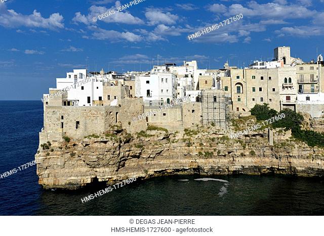 Italy, Puglia, Bari province, Polignano a Mare, creek of the port, old town built on an abrupt cliff which domain a small creek