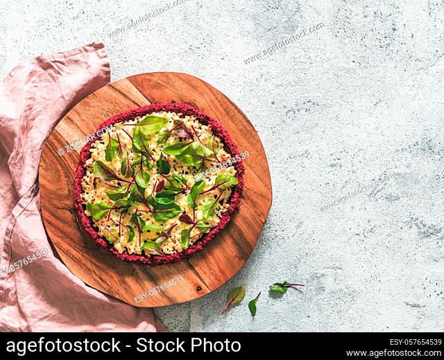 beetroot pizza crust with fresh swiss chard or mangold beetroot leaves.Ideas and recipes for healthy vegan snack.Egg-free pizza crust with chia seed and...