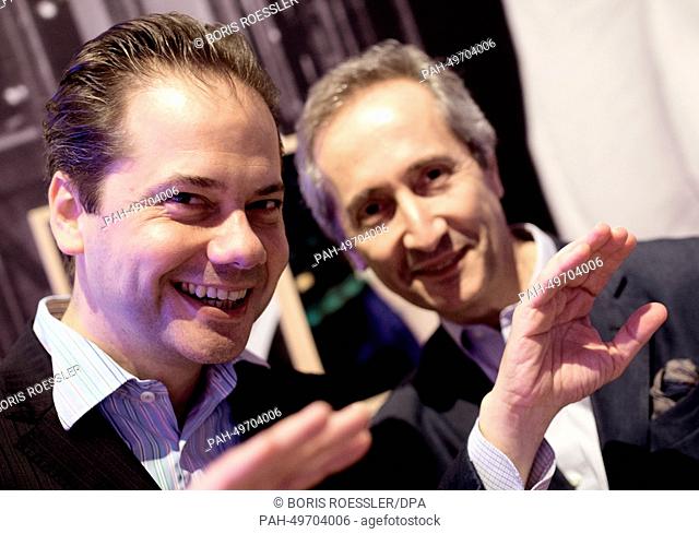 Jokingly Schirn director Max Hollein (L) and Bernard Blistene, director of the Centre Pompidou raise their hands to block a photographer in the exhibition...