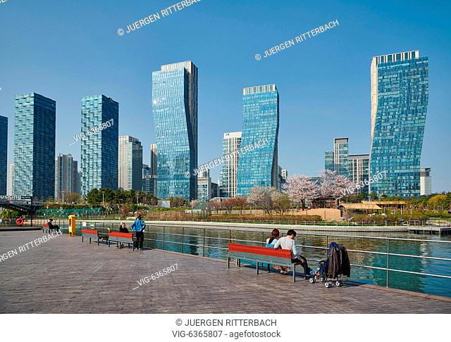 Central Park in Songdo International Business District with skyscraper in the back, Incheon City, South Korea - Incheon City, , South Korea, 19/04/2019