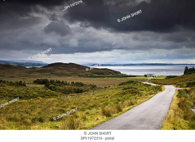 a country road through a hilly landscape along the coast, ardnamurchan argyl scotland