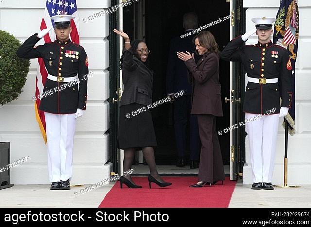 Judge Ketanji Brown Jackson waves to the crowd as she reenters the White House following her remarks commemorating her historic