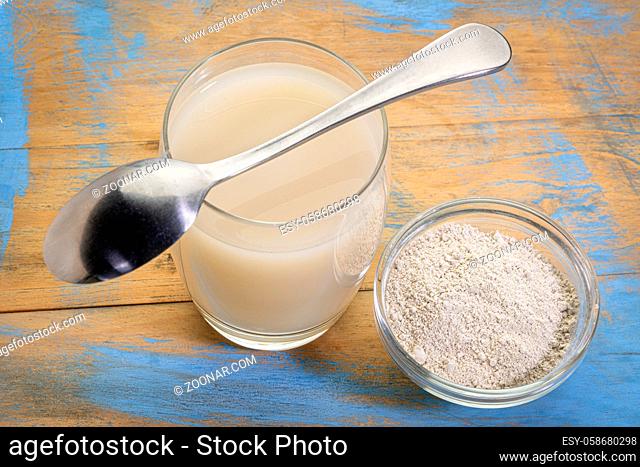 food grade diatomaceous earth supplement - powder and in a glass of water