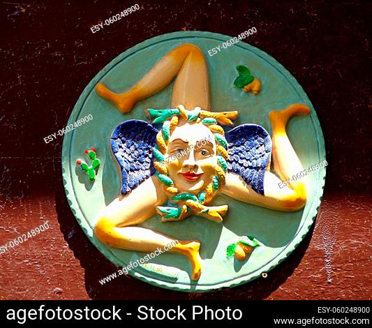 Three-legged symbol from Sicilian flag on green ceramic plate, Syracuse. High quality photo
