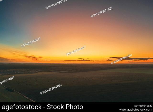Aerial View Of Sunrise Bright Sky. Scenic Colorful Sky At Dawn. Sunset Sky Above Autumn Field Landscape In Evening. Top View From High Attitude