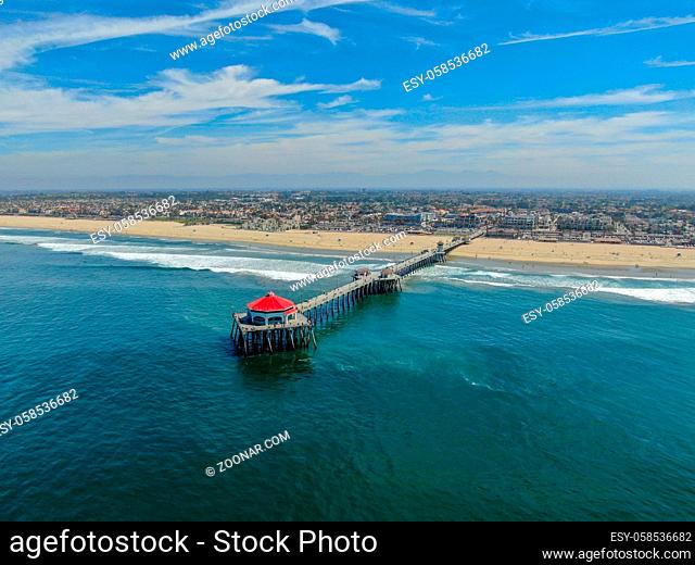 Aerial view of Huntington Pier, beach and coastline during sunny summer day, Southeast of Los Angeles. California. destination for surfer and tourist