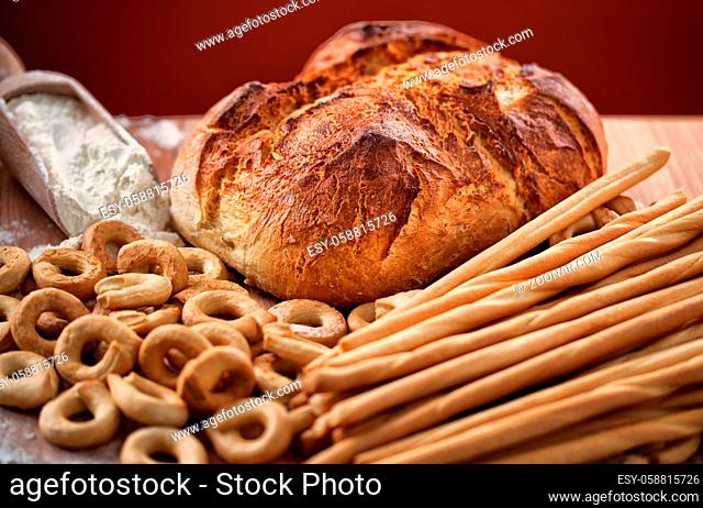Assortment of bakery products on a wooden table. High quality photo