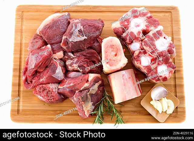 variety of meat for cooking and pot-au-feu on a cooking board