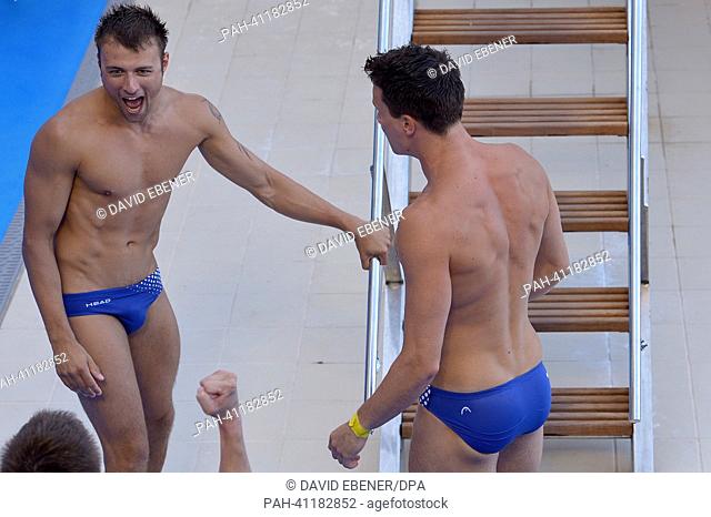 Gold medalists Patrick Hausding (R) and Sascha Klein of Germany celebrate after the men's 10m Synchro Platform diving final of the 15th FINA Swimming World...