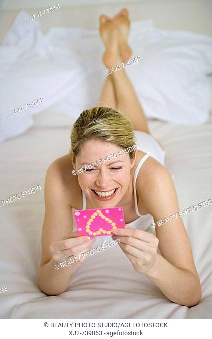 Woman reading a congratulations card