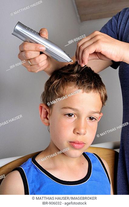 Nine-year-old boy getting a new haircut