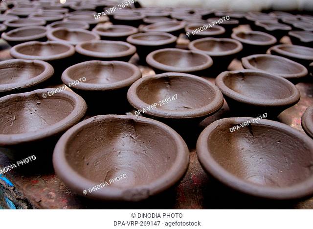 Earthenware clay lamps drying, Dharavi, Mumbai, Maharashtra, India, Asia