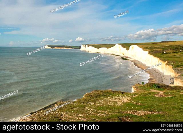 The Seven Sisters white chalk cliffs near Eastbourne in East Sussex, England. Viewed from Birling Gap looking towards Seaford Head in distance