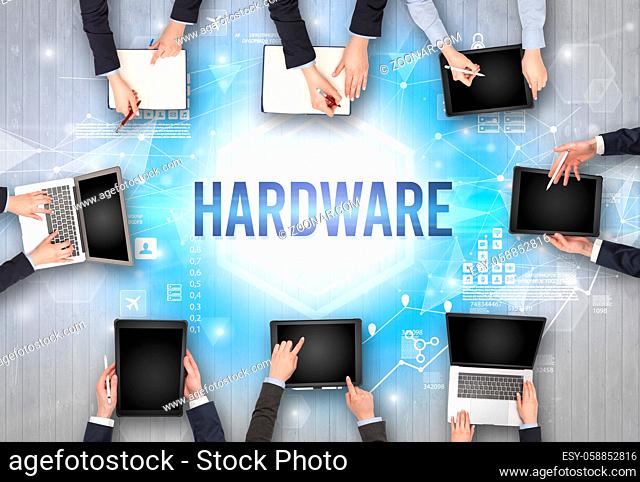 Group of Busy People Working in an Office with HARDWARE inscription, modern technology concept
