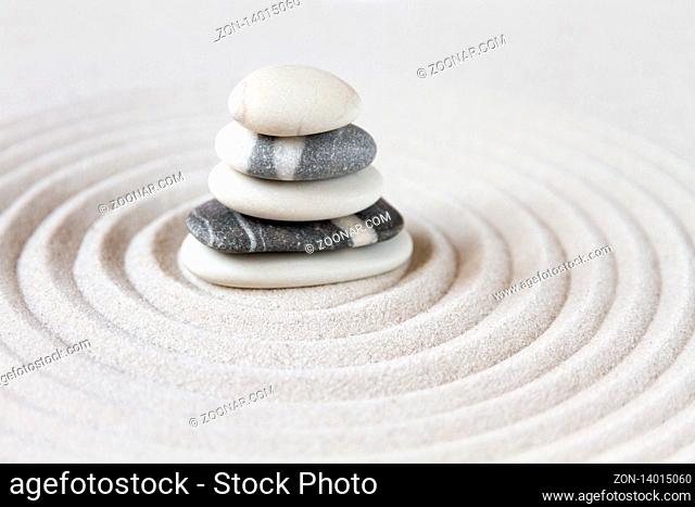 Black and white stones in the sand. Zen japanese garden background scene