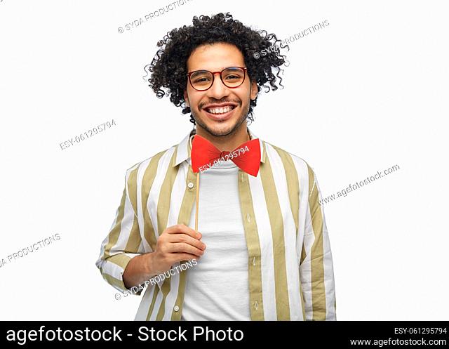smiling man with red bowtie party props