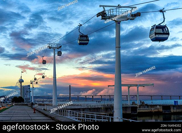 Lisbon, Portugal - 15 December 2020: view of the Telecabine Lisboa cable car gondolas at the World Expo grounds in Lisbon at sunset