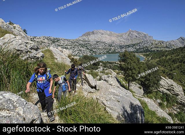 walkers starting the Three Thousand Route, (Tres Mils) Cuber Reservoir, Fornalutx, Majorca, Balearic Islands, Spain