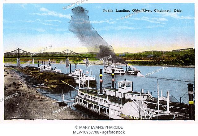 View of the public landing on the Ohio River at Cincinnati, Ohio, USA. In the foreground is the Telegraph river steamboat