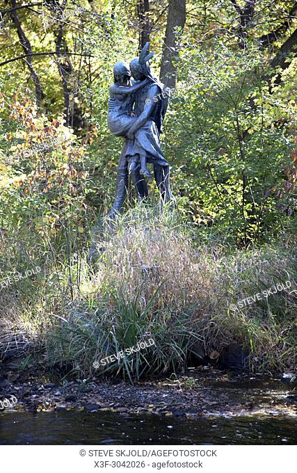Statue of Hiawatha holding Minnehaha near Minnehaha Falls by Fjelde, based on Longfellow's poem. Minneapolis Minnesota MN USA