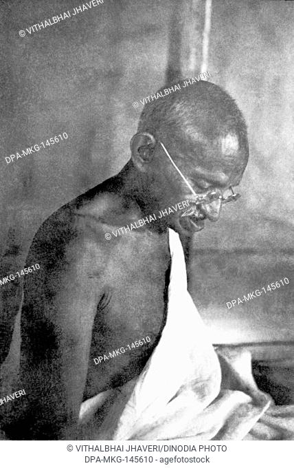 Mahatma Gandhi in his hut at Sevagram Ashram , 1939 NO MR