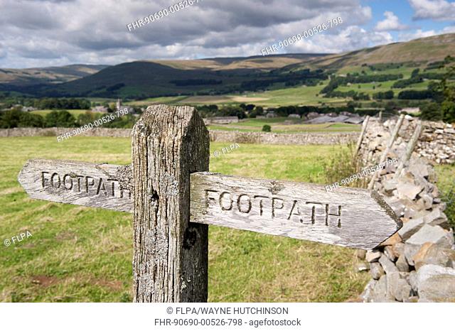 Wooden 'Footpath' sign post on public footpath, near Hawes, Wensleydale, Yorkshire Dales N.P., North Yorkshire, England, August