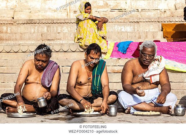 India, Uttar Pradesh, Banaras, Hindus sitting on ghat
