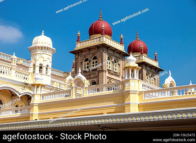 three Towers of Mysore Palace with red domes on blue sky, Mysore, India