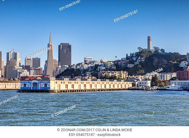 San Francisco skyline from the Alcatraz ferry, with the Transamerica building, the Coit Tower, and Pier 31, the embarkation per for Alcatraz Island