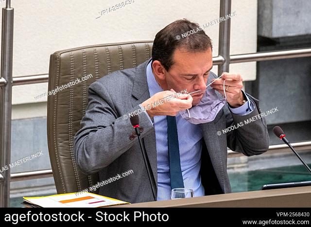 Flemish Minister of Welfare Wouter Beke pictures with his mouth mask at a plenary session of the Flemish Parliament in Brussels, Wednesday 21 October 2020