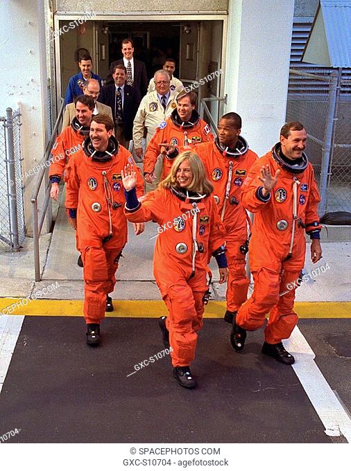 08/07/1997 -- The STS-85 flight crew greets a crowd of well-wishers as they walk out of the Operations and Checkout O&C Building for their ride to Launch Pad...