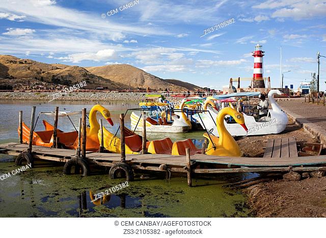Pedal boats for rent at the harbour, Puno Region, Lake Titicaca, Peru, South America