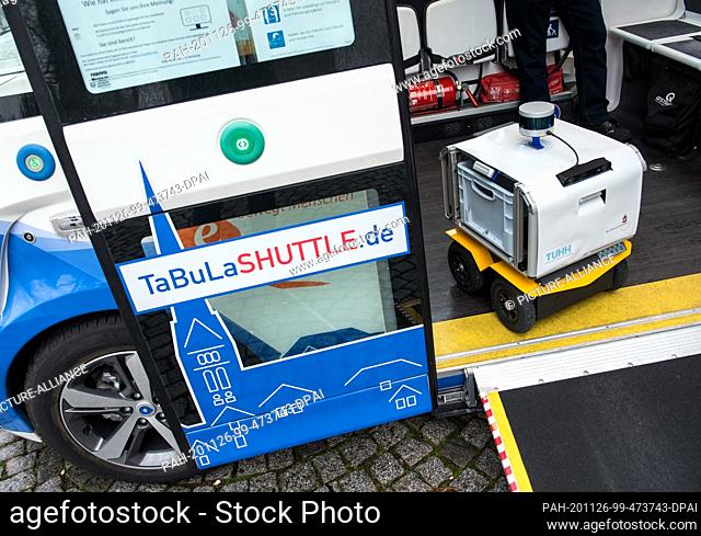 26 November 2020, Schleswig-Holstein, Lauenburg/Elbe: A prototype of a transport robot stands in an autonomously driving bus during a press meeting