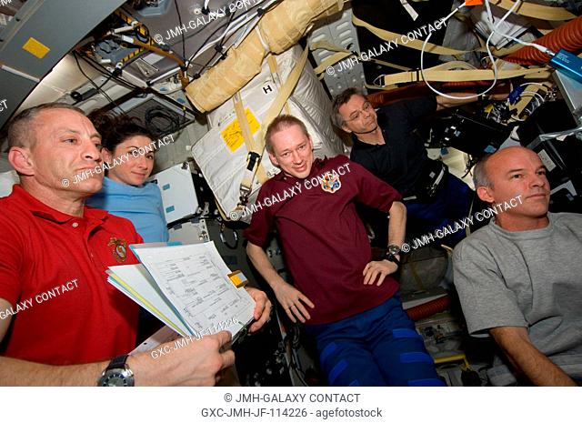 On Atlantis' middeck, from left, astronauts Charles O. Hobaugh, Nicole Stott, Frank De Winne, Robert Thirsk and Jeff Williams discuss their schedule for flight...