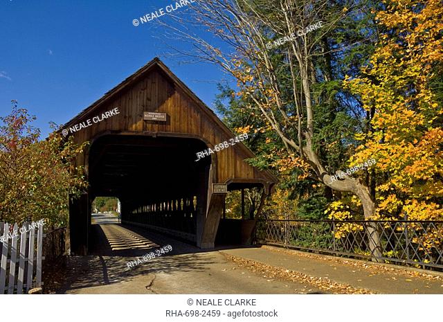 Autumn fall colours around traditional timber covered bridge Middle Bridge, Woodstock, Vermont, New England, United States of America, North America