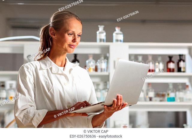 Portrait of a female researcher doing research in a chemistry lab (shallow DOF; color toned image)