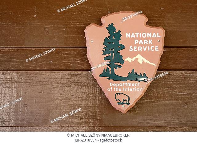The Arrowhead, the official emblem of the National Park Service with a sequoia tree, a bison, water and mountains, USA, America