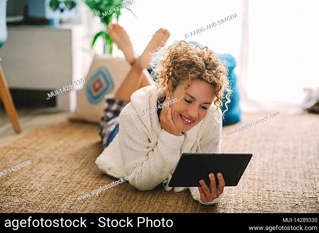 Woman, smile, floor, lie, tray, hold