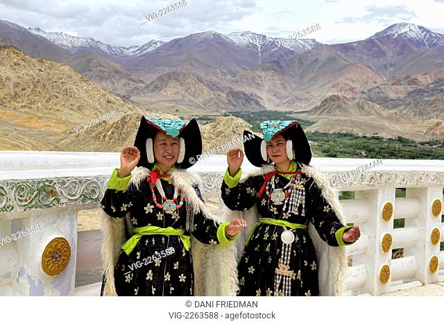 INDIA, LEH, 20.07.2010, Women wearing traditional Ladakhi costumes complete with the perak headdresses, long hats studded with turquoise