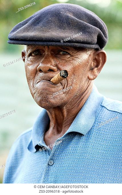 Elderly man with a cuban cigar in his mouth at the street, Vinales, Pinar del Río Province, Cuba, Antilles, Central America