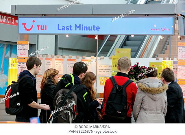A tourist group stands at the last minute counter of tourism company TUI at Hamburg Airport in Hamburg,  Germany, 18 March 2013