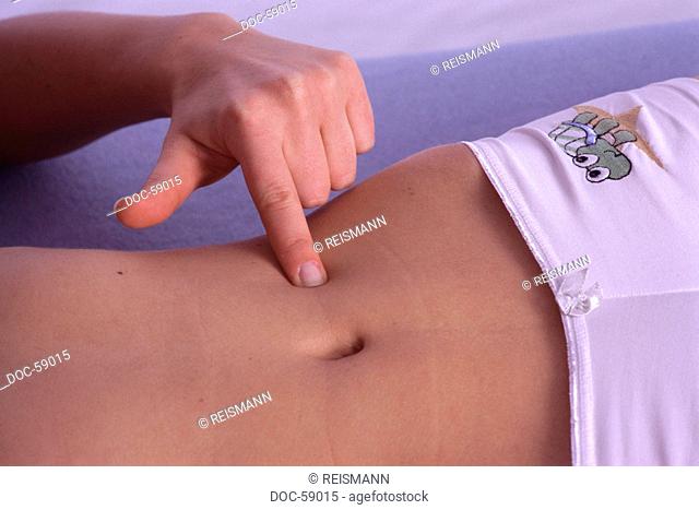 woman massaging acupressure point tu-schen against diarrhea