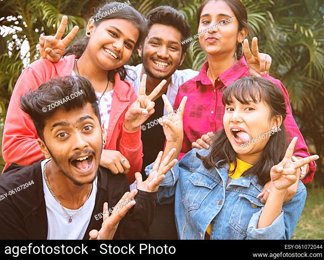 Young teenage friends taking selfie with funny faces - Concept of youth happy friendship having fun together - Millennials of selfie generation