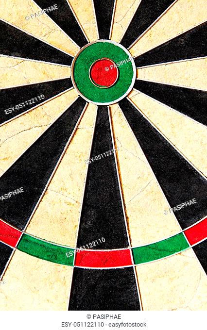 closeup of an dartboard with triples and bullseye