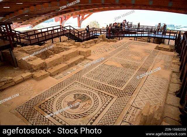 Kourion, Limassol - May 9, 2015: Tourists walking around the preserve Mosaics that decorate the floors at the ancient theater of Kourion in Limassol, Cyprus