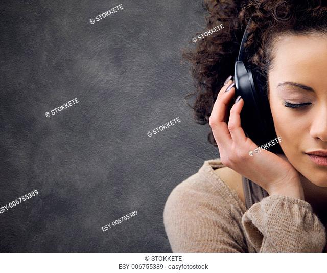 young beautiful woman enjoying music