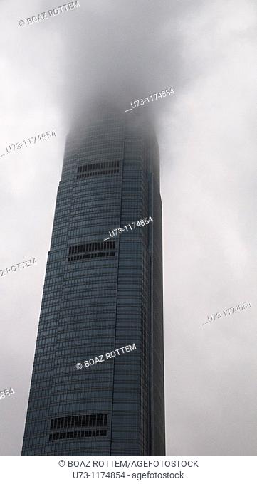 IFC tower in Hong Kong covered with clouds