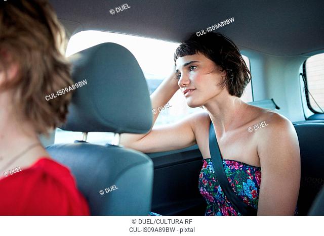 Young woman looking out of car window