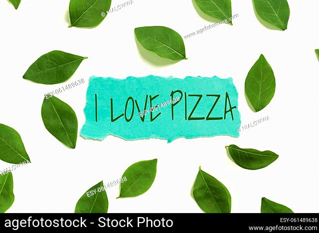 Hand writing sign I Love Pizza, Internet Concept To like a lot Italian food with cheese ham pepperoni in slices Blank Paper Surrounded With Leaves For Wedding...